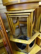 Hexagonal glass topped occasional table and a nest of three mid Century teak tables
