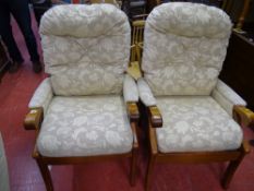 Pair of predominantly cream and floral upholstered easy chairs