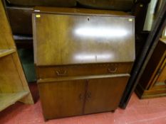 Writing bureau with single drawer over two base cupboards