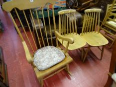 Modern light wood stick back rocking chair and two light wood stick back chairs