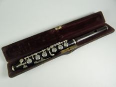 A vintage cased wooden piccolo