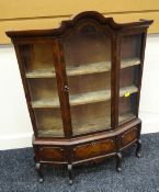 A miniature mahogany standing bijouterie cabinet having an arched glazed centre door flanked by