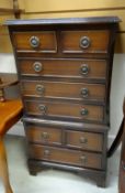 A reproduction mahogany small chest-on-chest