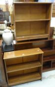 A pair of narrow low dark wood bookcases
