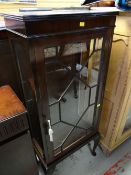 A vintage astragal glazed mahogany display cabinet on raised feet