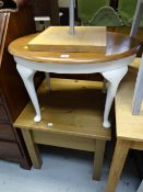 A small pine side table together with a painted oval coffee table