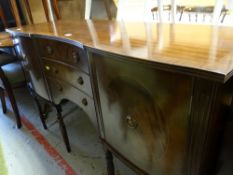 Reproduction mahogany concave sideboard, three drawers flanked by two cupboards on raised feet