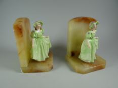 Pair of onyx female figure decorated bookends