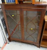 A narrow reproduction mahogany astragal glazed bookcase