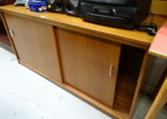 A teak two sliding door low cabinet