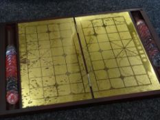 A boxed Mahjong set in carry bag