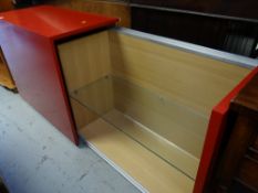 A modern designer red lacquered slide opening sideboard