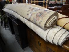 A large woollen floral decorated rug