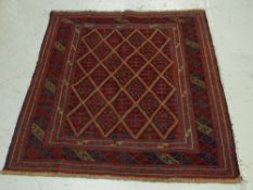 A red & blue patterned Gazak rug, 121 x 113cms