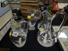 Five items of Mary Gregory decorated glassware including jugs, vase etc
