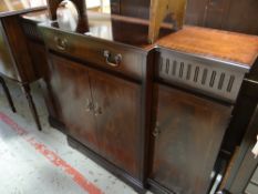 A reproduction mahogany breakfront sideboard