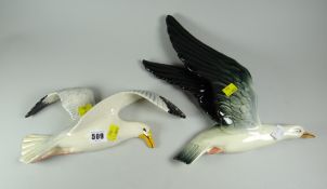 A Beswick seagull wall plaque together with another similar