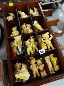 A collection of ceramic teddy bears & wall hanging display stands