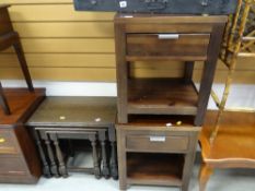 Two modern dark wood bedside cabinets together with an oak nest of three tables