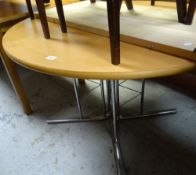 A modern circular lightwood & chrome leg dining table