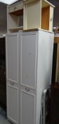 A white wood two-door wardrobe & two bedside cabinets