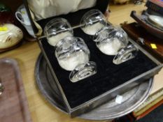 A circular EPNS presentation tray together with a boxed set of four glass sundae dishes