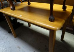 A modern lightwood kitchen / dining table