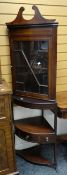 A mahogany & inlaid standing corner cabinet on a raised open shelf base