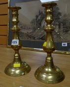 A pair of Victorian brass candlesticks