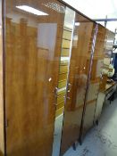 A vintage Merrydew bedroom suite comprising mirrored dressing table, large & small wardrobe,