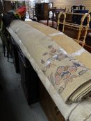 A large woollen floral decorated rug