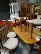 A very nice stylish retro-style extending dining table & six matching oatmeal upholstered dining