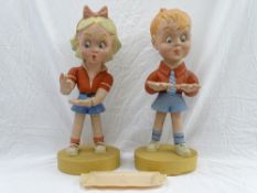 A PAIR OF COMPOSITION ADVERTISING FIGURES FOR FORTES ICES of a young girl and boy standing on