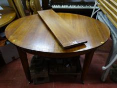 A FRENCH INLAID MAHOGANY EXTENDING DINING TABLE with single additional leaf, on tapering supports