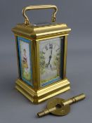 A FRENCH MINIATURE BRASS & PORCELAIN ENAMEL CARRIAGE CLOCK set with Roman numerals, the movement