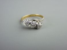 AN EIGHTEEN CARAT GOLD & PLATINUM THREE STONE DIAMOND RING the stones in heart shaped settings, 2.