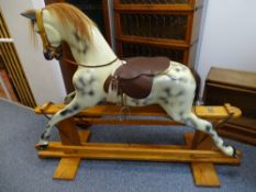 A HADDON OF WALLINGFORD ANTIQUE STYLE COMPOSITE ROCKING HORSE, finished in dapple colours with
