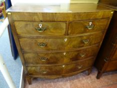A GEORGIAN MAHOGANY BOW FRONT CHEST of two short over three long drawers with string inlay