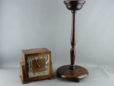 AN OAK CASED ART DECO MANTEL CLOCK with a wooden smoker's stand