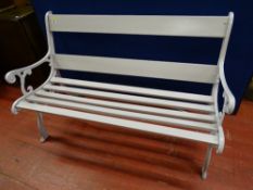 A WELL PRESENTED GARDEN BENCH with cast iron ends, 80 cms high, 124.5 cms wide, 70 cms deep