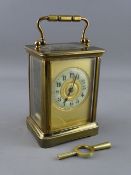 A FRENCH BRASS CASED CARRIAGE CLOCK, the enamel dial set with Arabic numerals, 14 cms high handle