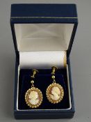 A PAIR OF NINE CARAT GOLD SCREW-FIX CAMEO EARRINGS