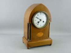 A LANCET TOP INLAID MAHOGANY MANTEL CLOCK having brass pillar decoration and ball feet, the French