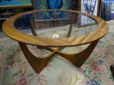 A G-PLAN TEAK CIRCULAR GLASS TOPPED COFFEE TABLE, 45 cms high, 83.5 cms diameter
