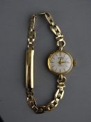 A LADY'S NINE CARAT GOLD CIRCULAR DIAL GRADUS WRISTWATCH with decorative nine carat gold floral link