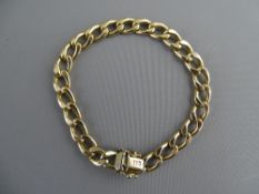 A GENT'S NINE CARAT GOLD LINK BRACELET with safety clasp, 8.9 grms