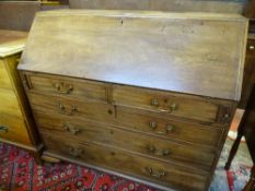 A GEORGIAN MAHOGANY FALL FRONT BUREAU with interior arrangement of satin wood and mahogany