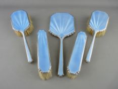 A FIVE PIECE SILVER & GUILLOCHE ENAMEL HAND MIRROR & BRUSH SET, Birmingham 1947 (enamel slightly A/F