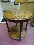 A BARLEY TWIST OAK SIDE TABLE with piecrust top and circular under tier shelf, 74 cms high, 63 cms