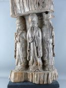 A LARGE JAPANESE WOOD CARVING depicting three sage or sennin, inset carved in relief, the top,